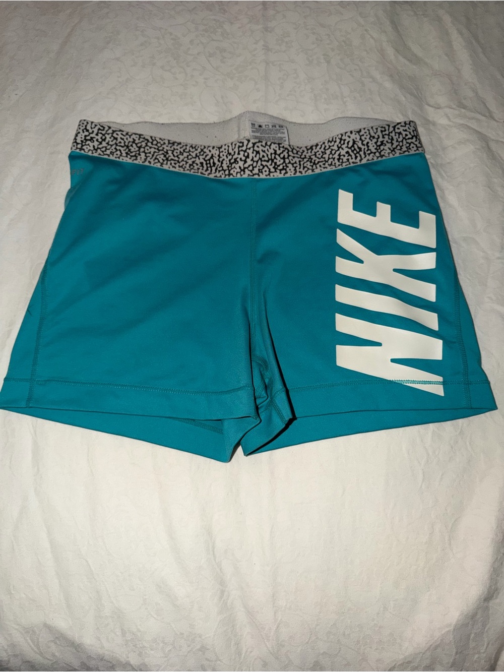 Nike Women's Teal Athletic Shorts with White Logo